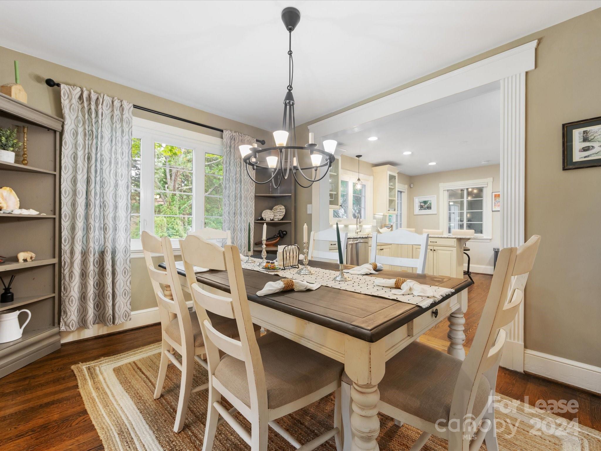 4411 Castleton Road Charlotte, NC 28211 - Photo 13 of 45 a view of a dining room with furniture window and wooden floor