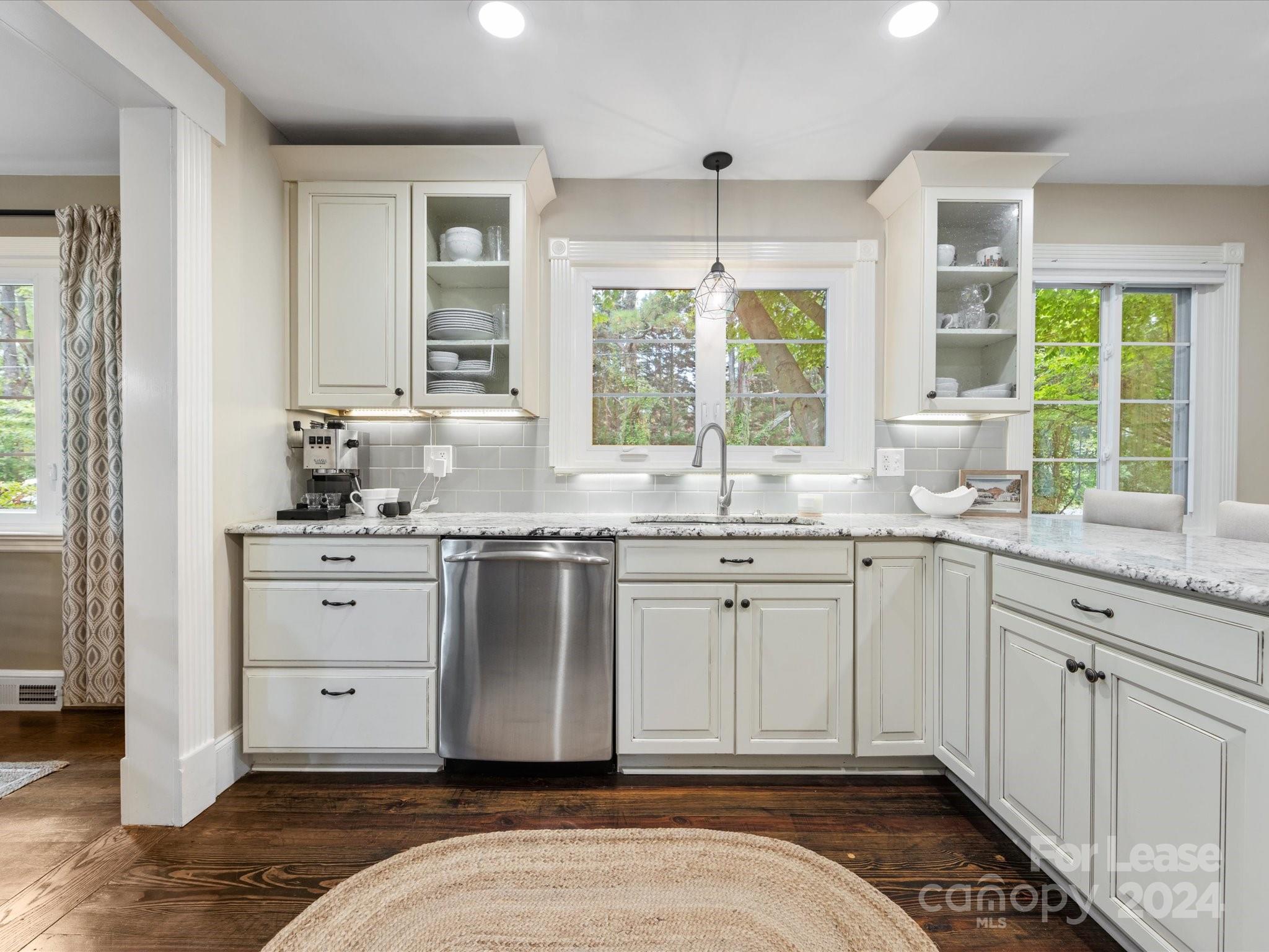 4411 Castleton Road Charlotte, NC 28211 - Photo 16 of 45 a spacious bathroom with a granite countertop sink and a window