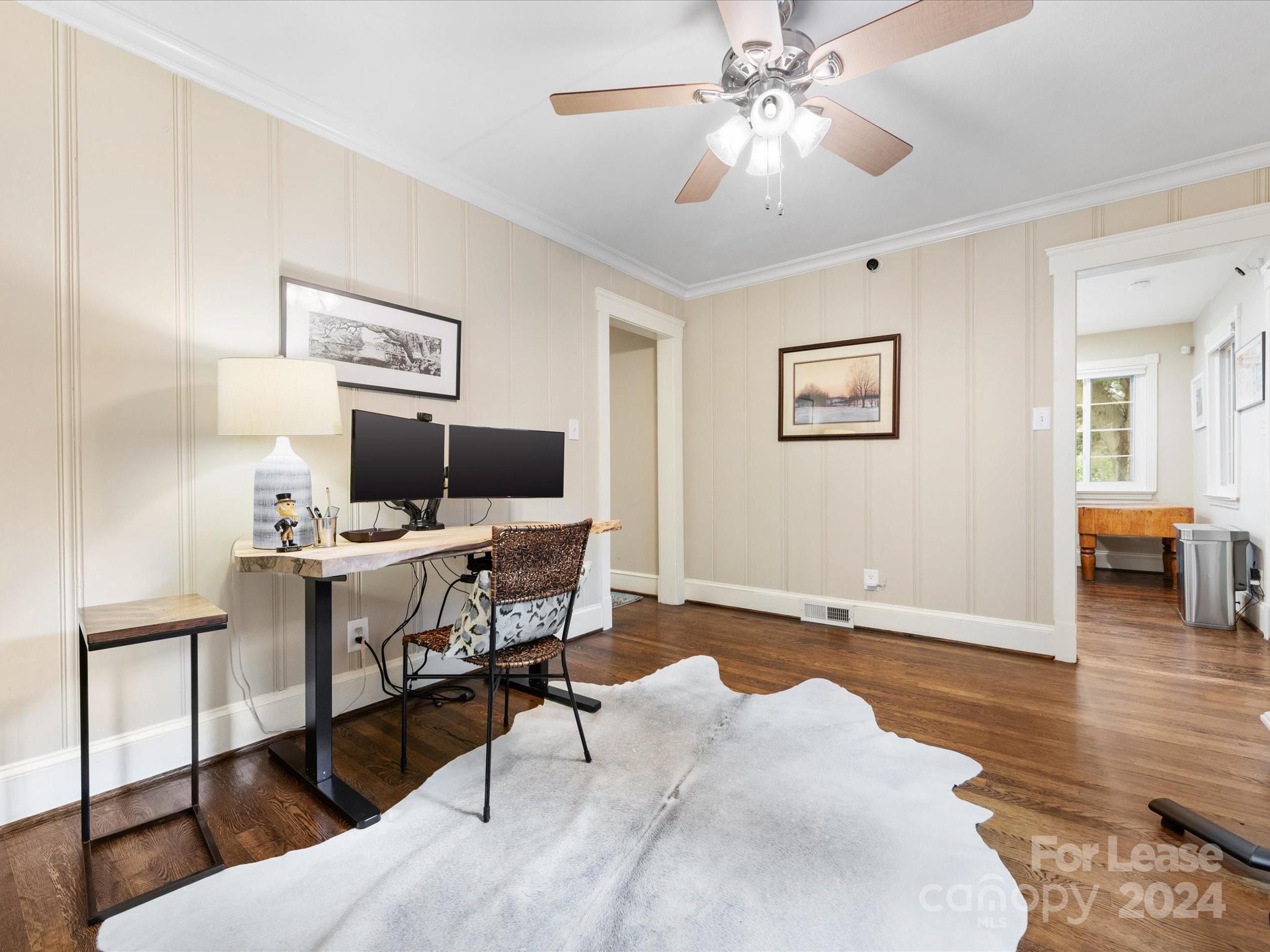 4411 Castleton Road Charlotte, NC 28211 - Photo 24 of 45 a workspace with wooden floor and a workspace