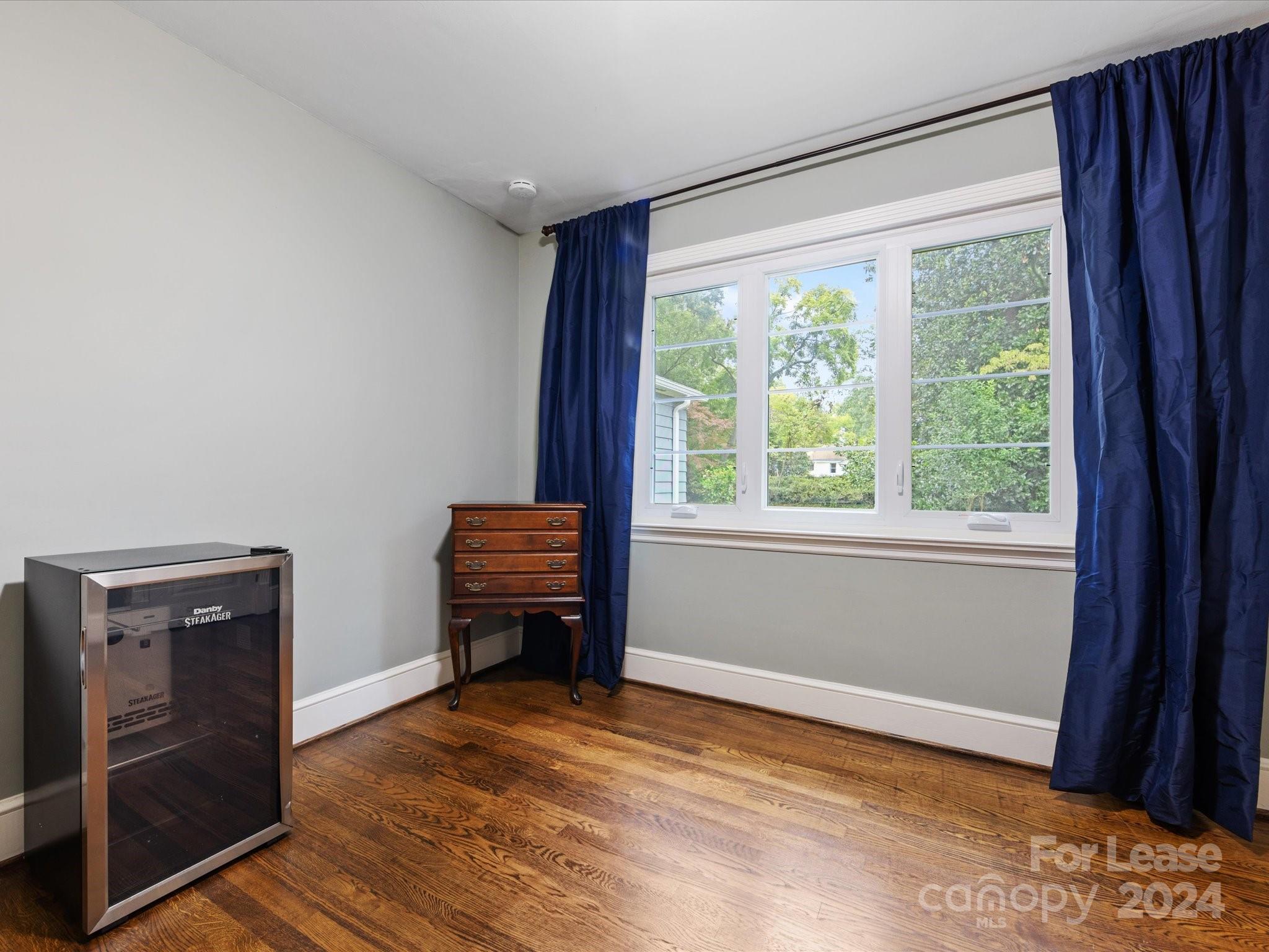 4411 Castleton Road Charlotte, NC 28211 - Photo 30 of 45 a view of room with window and wooden floor
