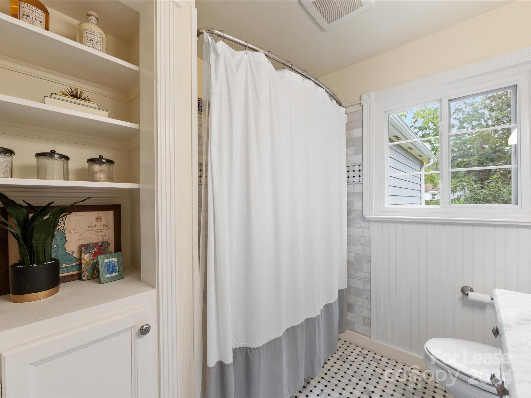 4411 Castleton Road Charlotte, NC 28211 - Photo 33 of 45 a bathroom with a sink and a mirror