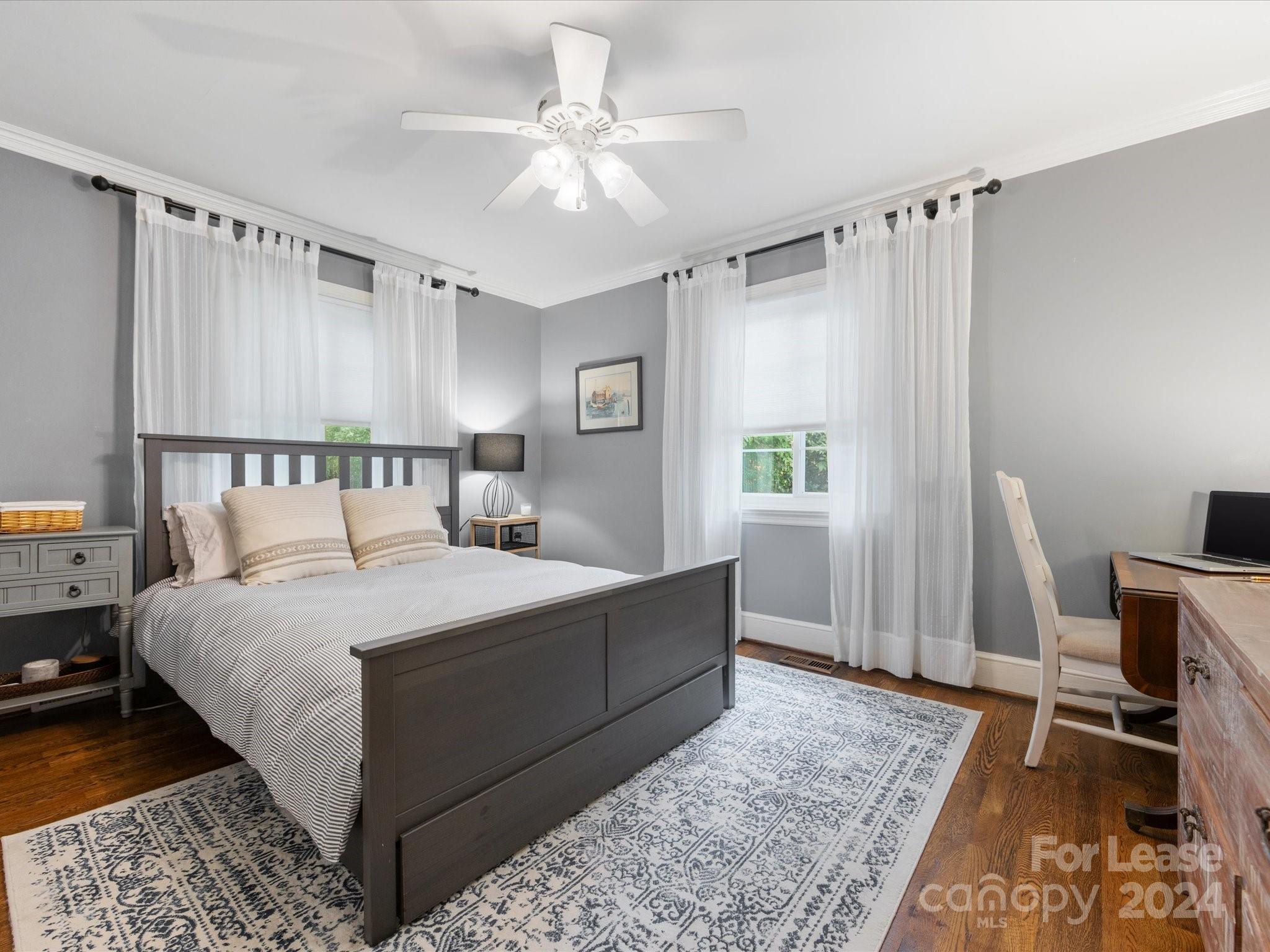 4411 Castleton Road Charlotte, NC 28211 - Photo 36 of 45 a bedroom with a bed table and a window