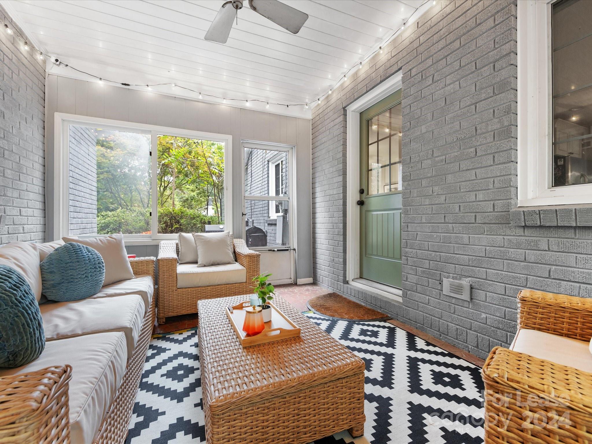 4411 Castleton Road Charlotte, NC 28211 - Photo 37 of 45 a living room with furniture and a large window
