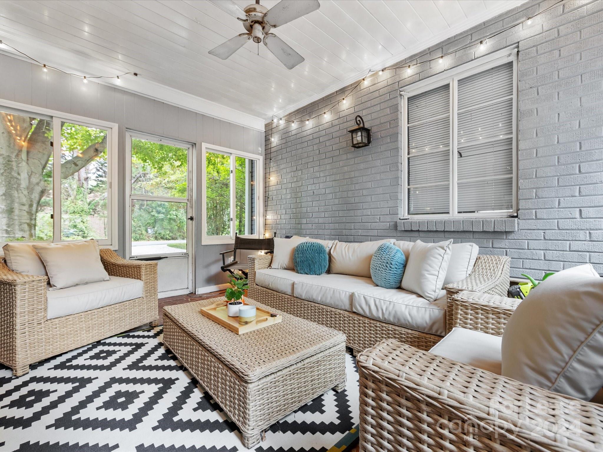 4411 Castleton Road Charlotte, NC 28211 - Photo 38 of 45 a living room with furniture and a large window