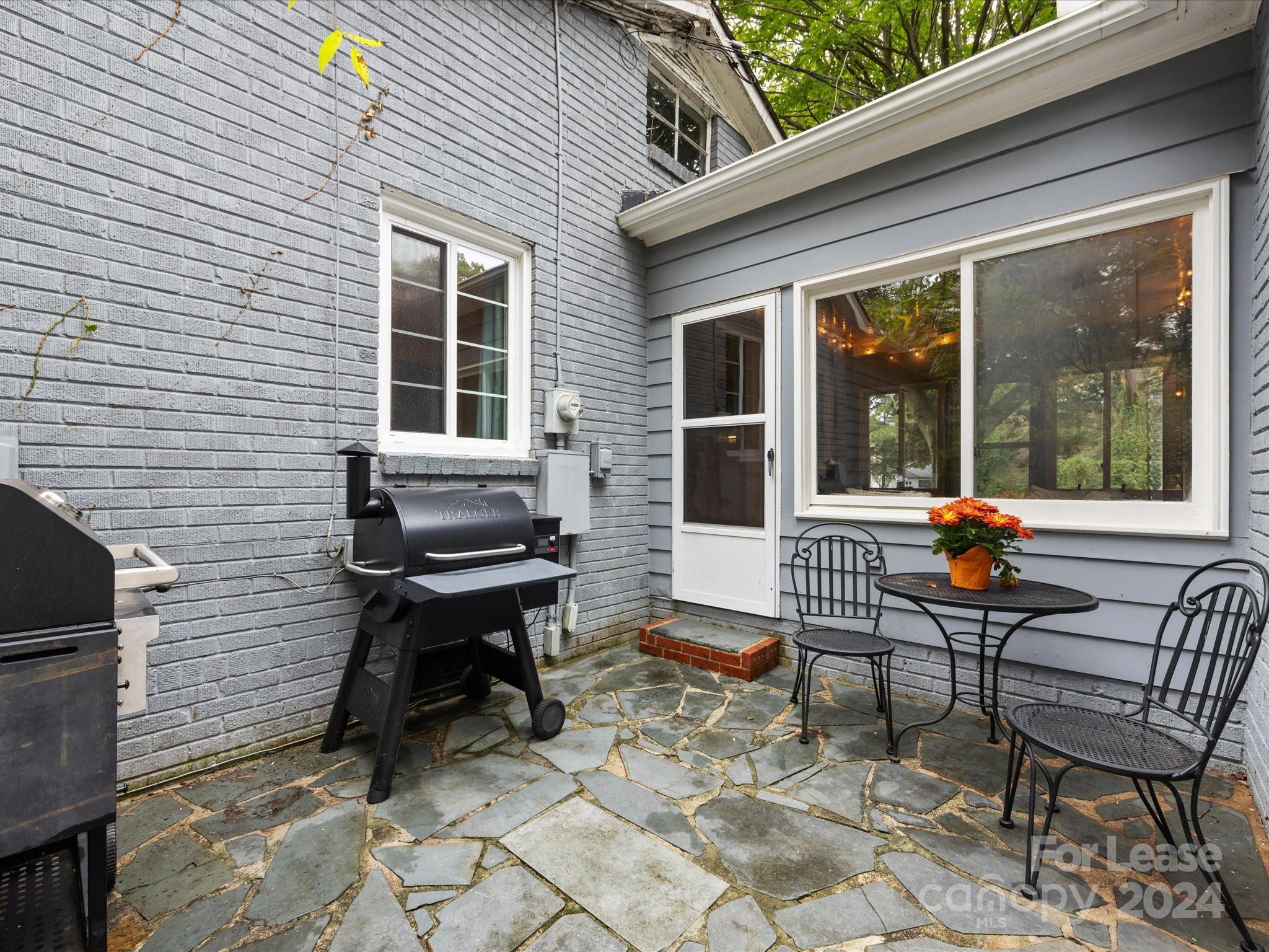 4411 Castleton Road Charlotte, NC 28211 - Photo 40 of 45 a balcony view with a couple of chairs in front of a house