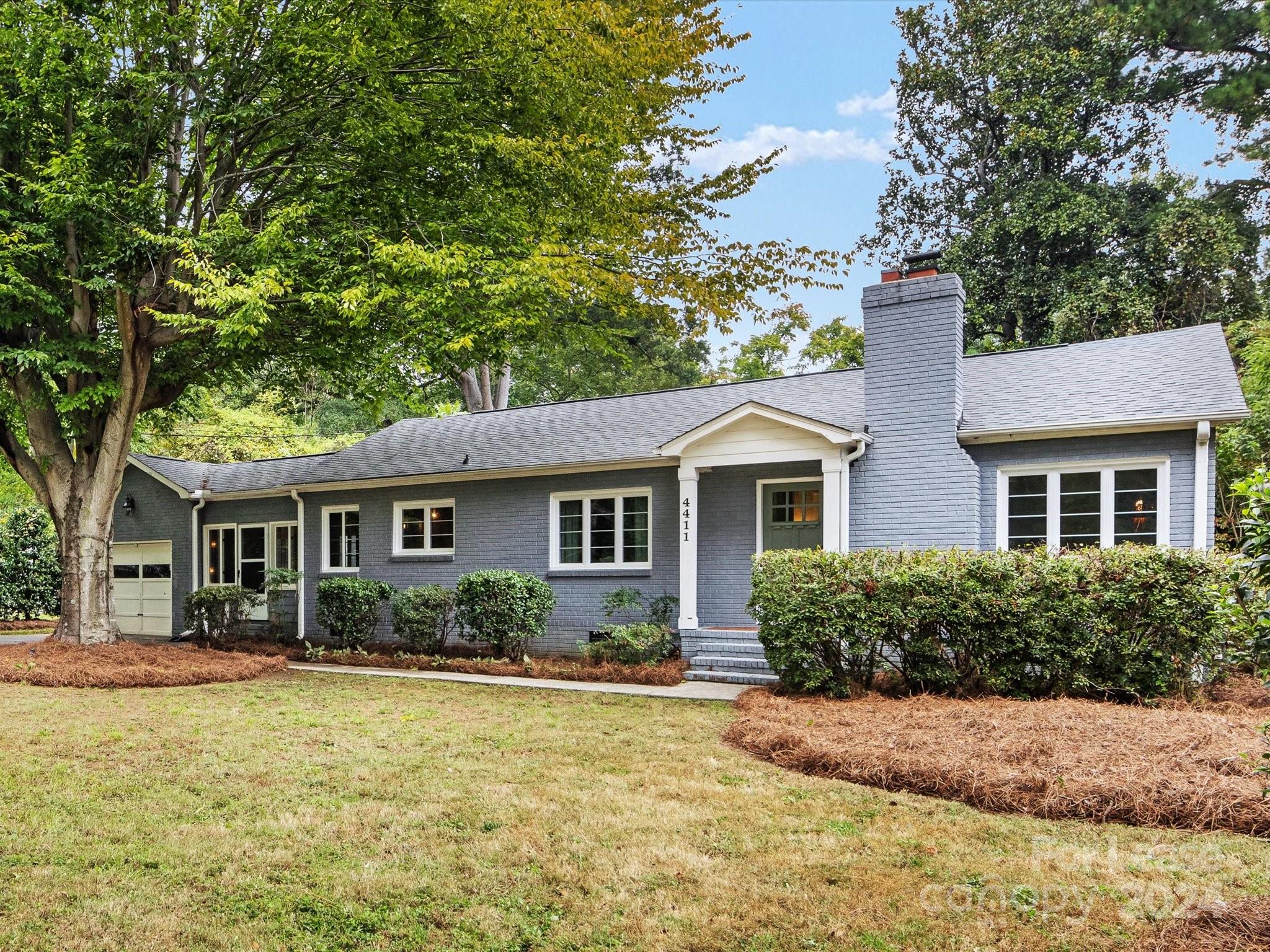 4411 Castleton Road Charlotte, NC 28211 - Photo 4 of 45 a front view of house with yard and trees around