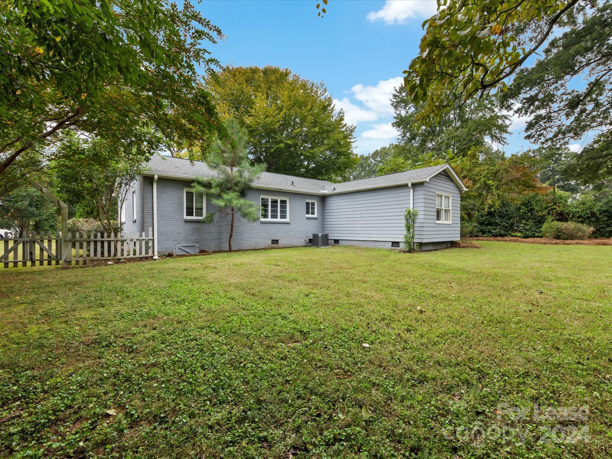 4411 Castleton Road Charlotte, NC 28211 - Photo 44 of 45 a house view with a garden space