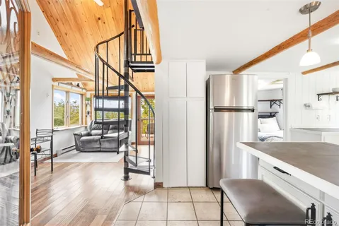 a kitchen with stainless steel appliances granite countertop a refrigerator and a stove