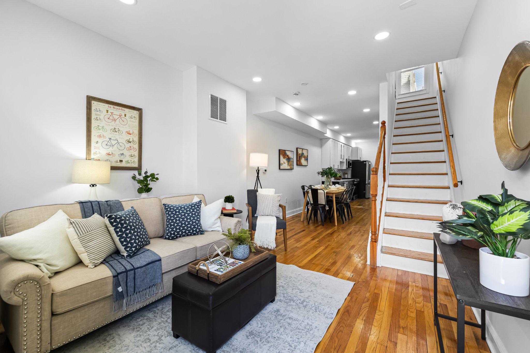 1225 Patapsco Street Baltimore, MD 21230 - Photo 1 of 21 a living room with furniture and a wooden floor