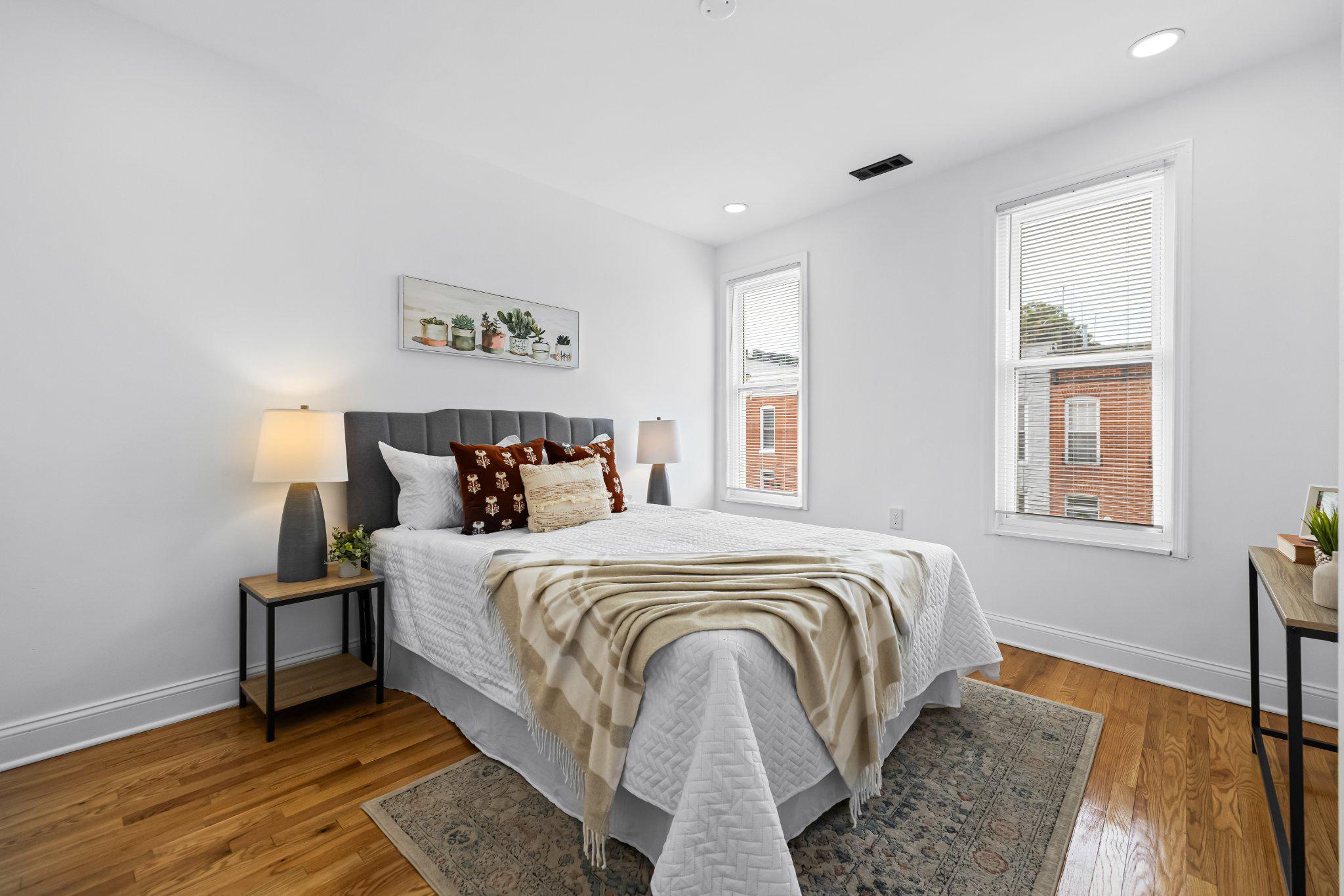 1225 Patapsco Street Baltimore, MD 21230 - Photo 11 of 21 a bed sitting in a bedroom next to a window