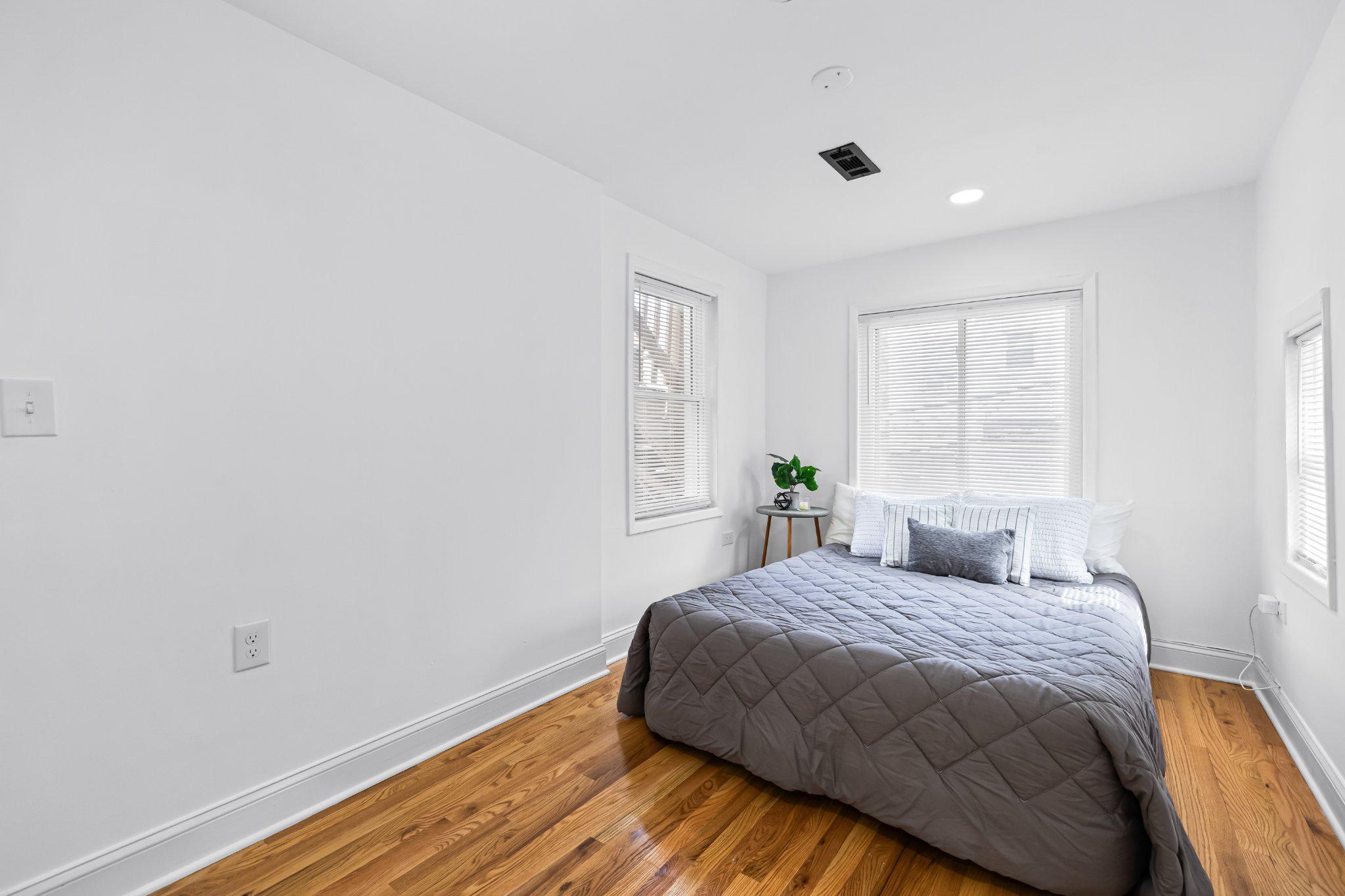 1225 Patapsco Street Baltimore, MD 21230 - Photo 15 of 21 a bedroom with a bed and a window