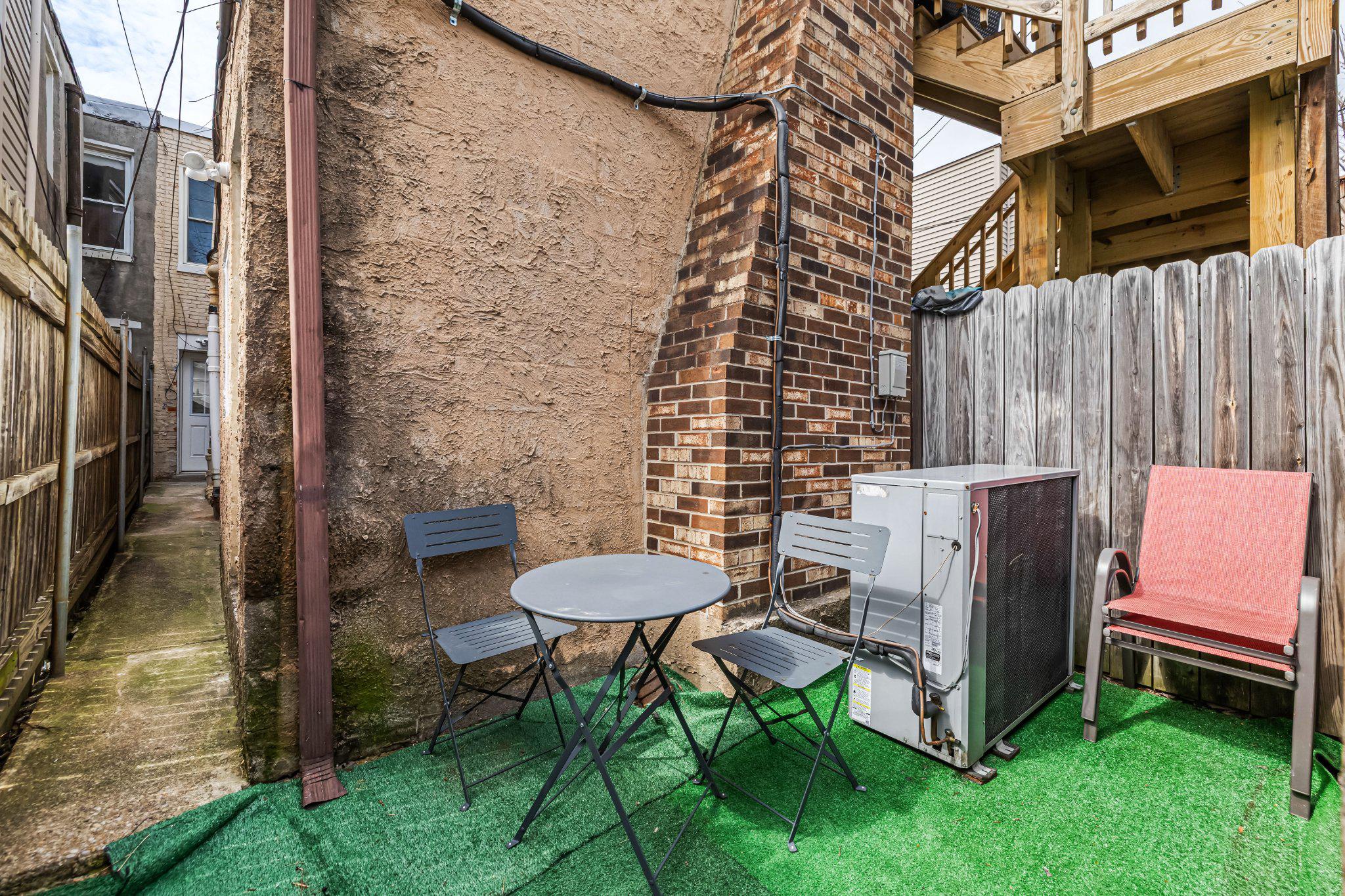 1225 Patapsco Street Baltimore, MD 21230 - Photo 20 of 21 a view of a chairs in backyard of the house