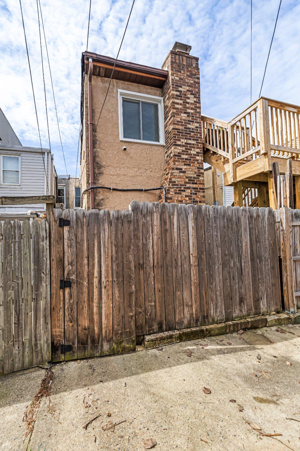 1225 Patapsco Street Baltimore, MD 21230 - Photo 21 of 21 a front view of a house with a yard