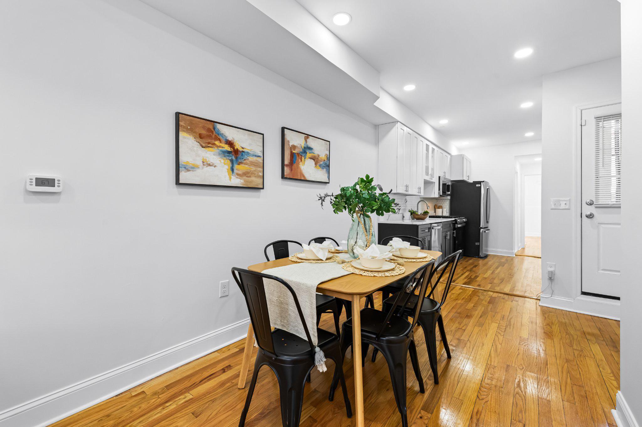 1225 Patapsco Street Baltimore, MD 21230 - Photo 3 of 21 a view of a dining room with furniture and wooden floor