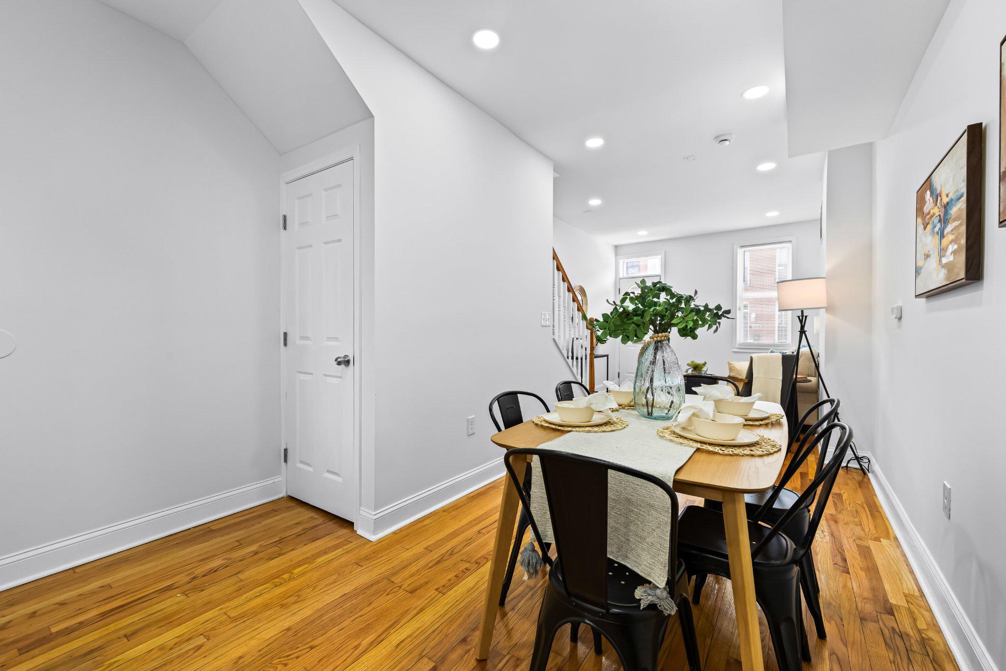 1225 Patapsco Street Baltimore, MD 21230 - Photo 4 of 21 a view of a dining room with furniture and wooden floor