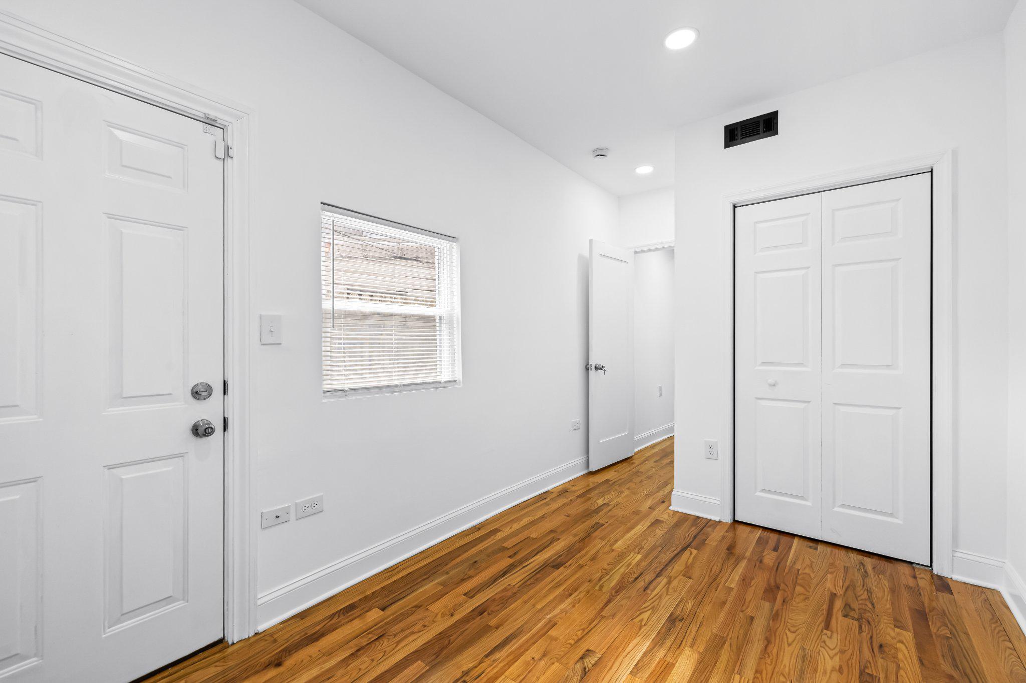 1225 Patapsco Street Baltimore, MD 21230 - Photo 9 of 21 a view of an empty room with wooden floor