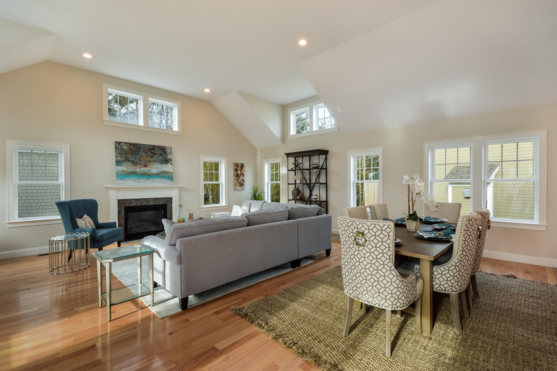 a living room with furniture fireplace and window