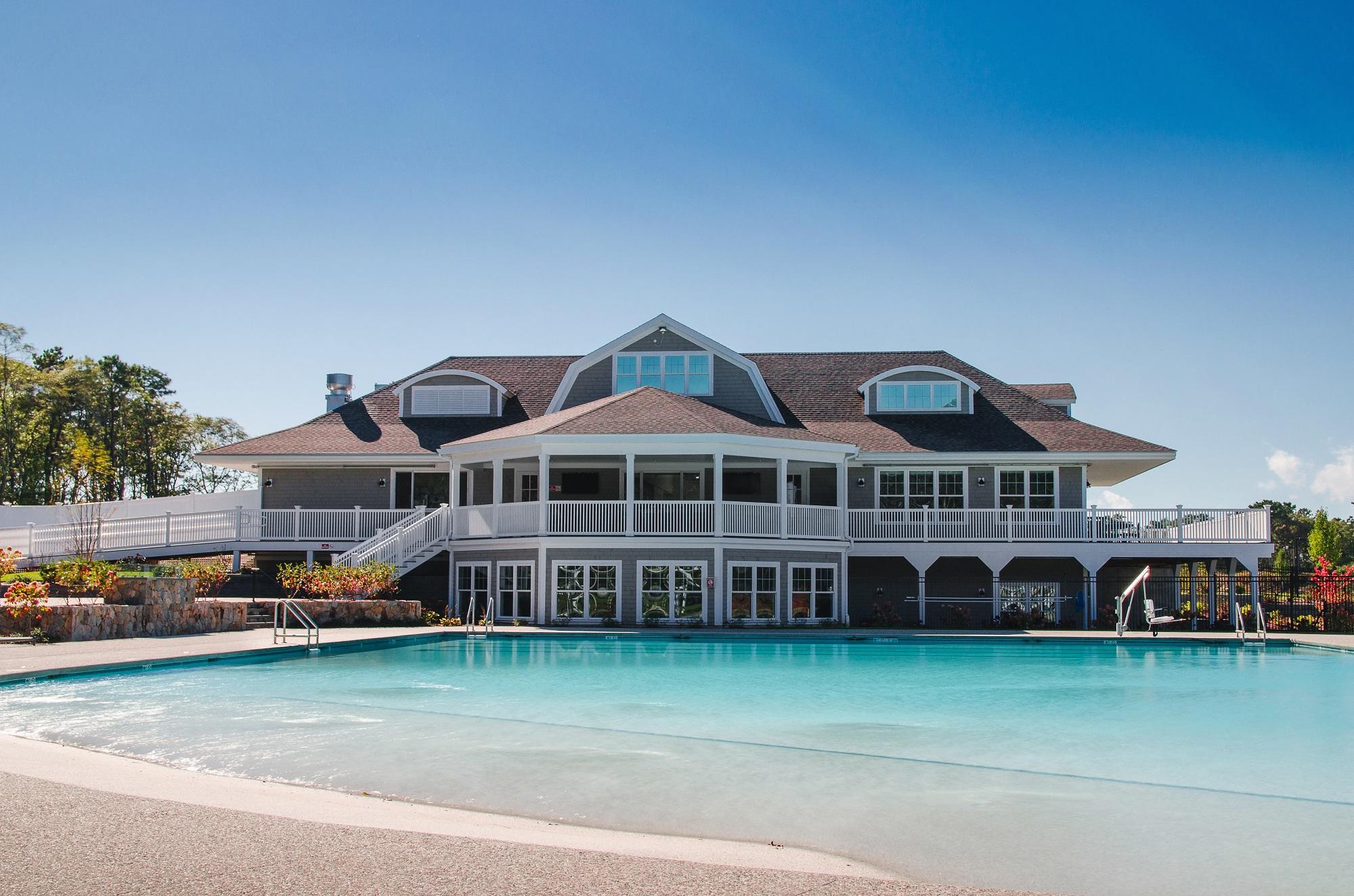 23 Rosewood Circle Mashpee, MA 02649 - Photo 19 of 25 a front view of a house with a garden and lake view