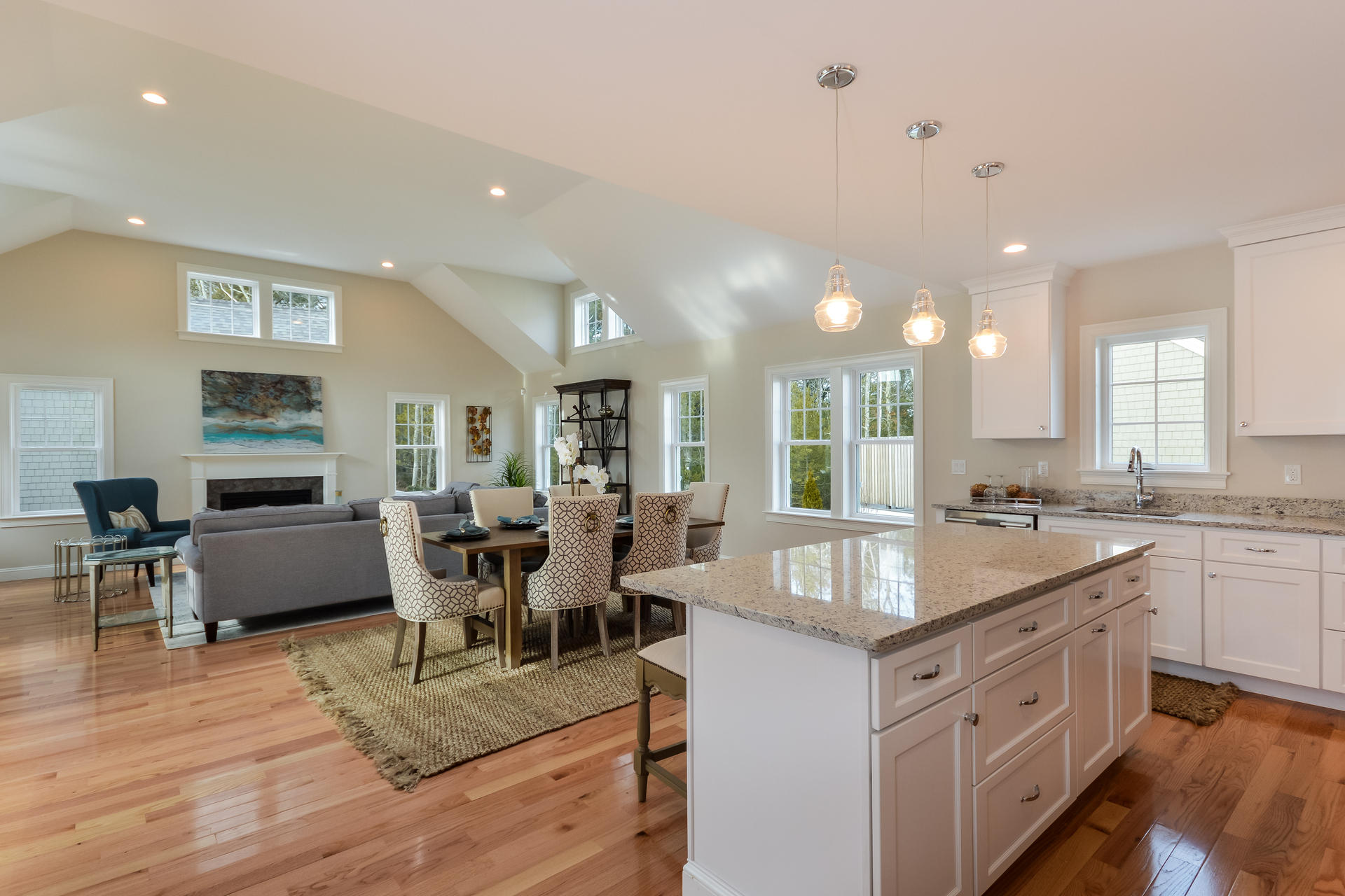 23 Rosewood Circle Mashpee, MA 02649 - Photo 6 of 25 a large kitchen with kitchen island a sink table and chairs