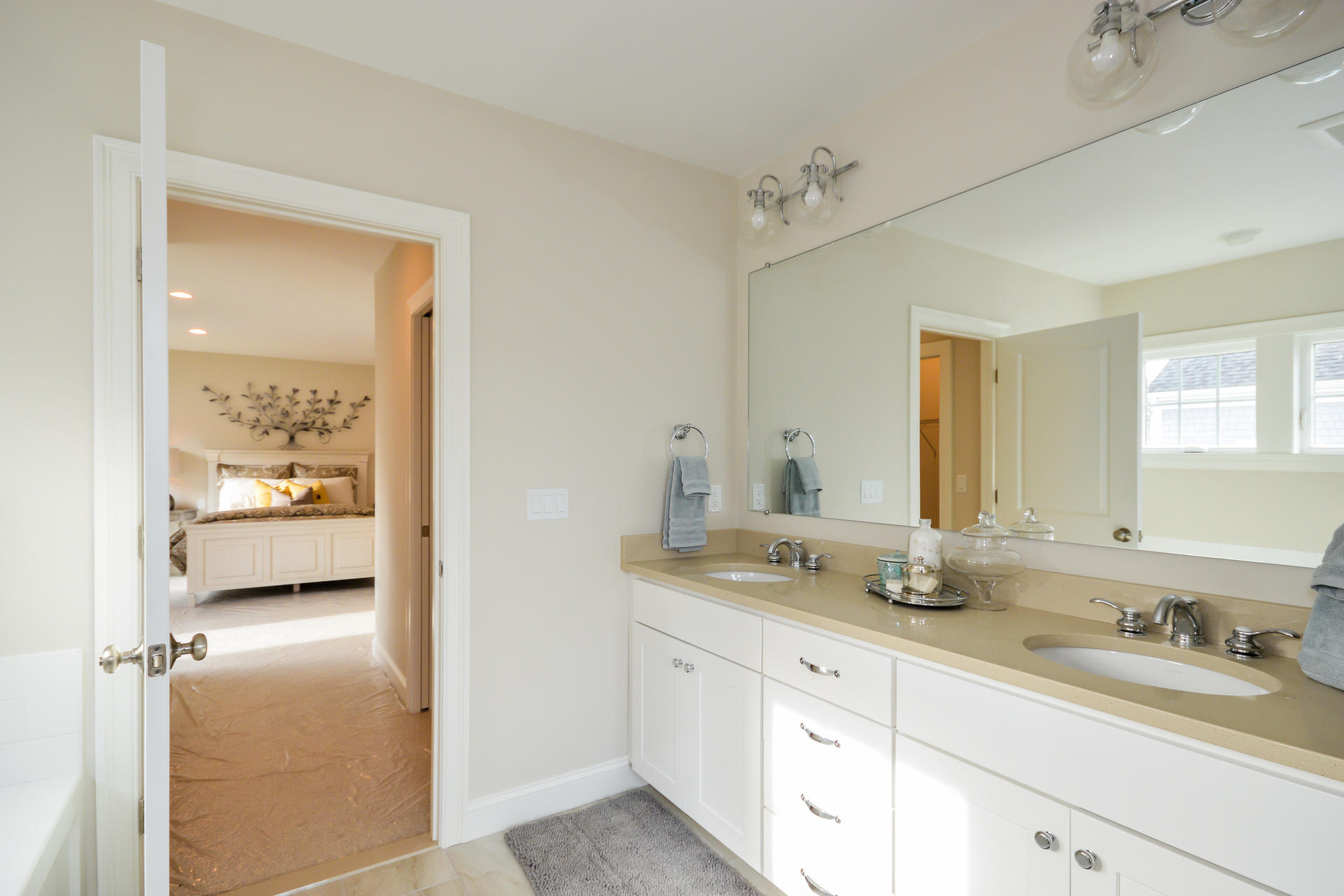 23 Rosewood Circle Mashpee, MA 02649 - Photo 10 of 25 a en suite bathroom with a granite countertop sink and a mirror