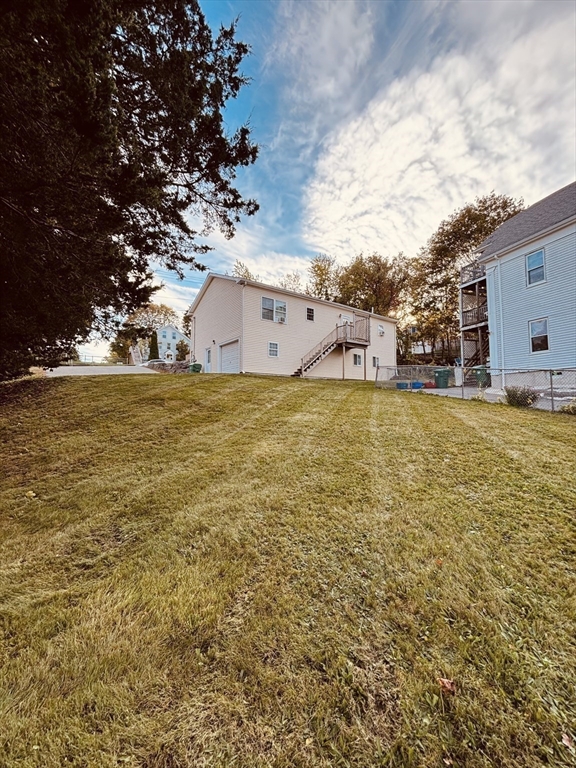 180 Beacon Street Clinton, MA 01510 - Photo 19 of 30 a view of a large body of water with a building in the background