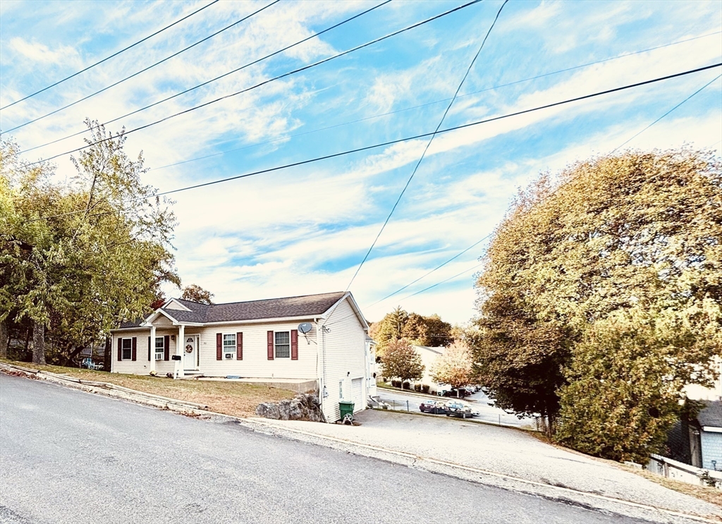 180 Beacon Street Clinton, MA 01510 - Photo 21 of 30 a view of a white house with a street