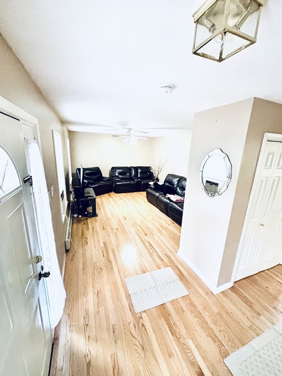 180 Beacon Street Clinton, MA 01510 - Photo 5 of 30 a view of a living room with furniture and wooden floor