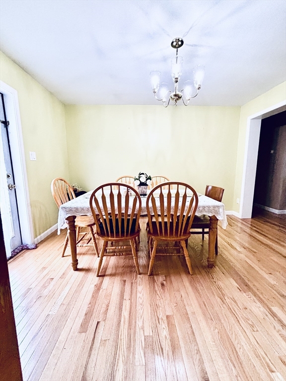 180 Beacon Street Clinton, MA 01510 - Photo 7 of 30 a view of a dining room with furniture and wooden floor