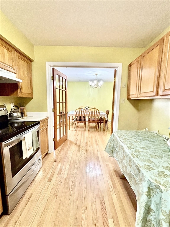 180 Beacon Street Clinton, MA 01510 - Photo 8 of 30 a view of kitchen with wooden floor and cabinets