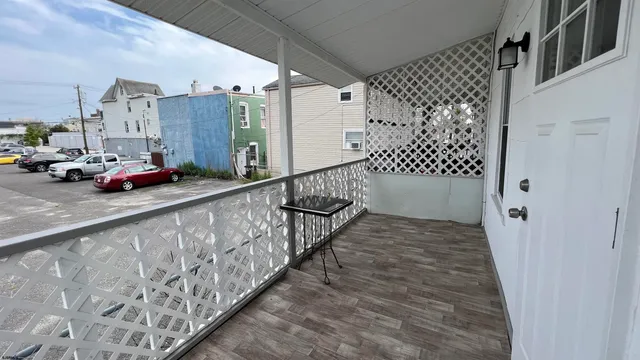 a view of a balcony with car parked