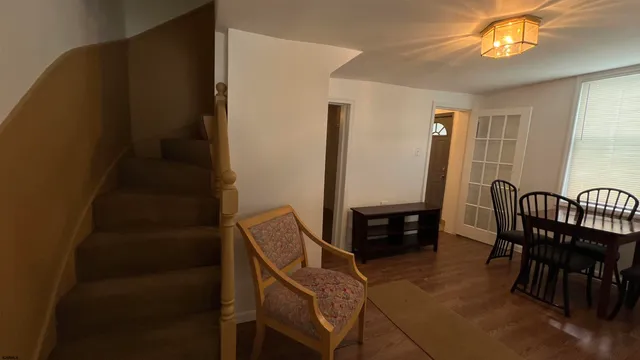 a view of a livingroom with furniture and a window