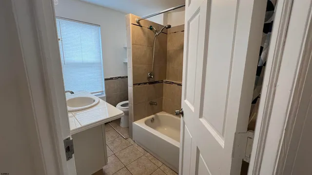 a bathroom with a tub and a shower