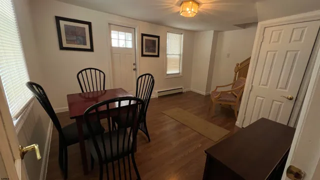 a view of a workspace with furniture and entryway