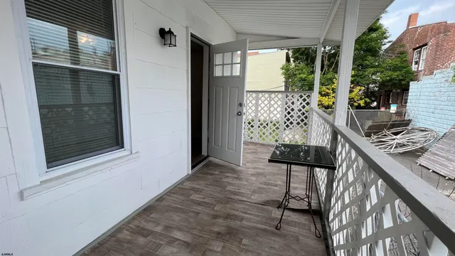 a view of balcony with furniture