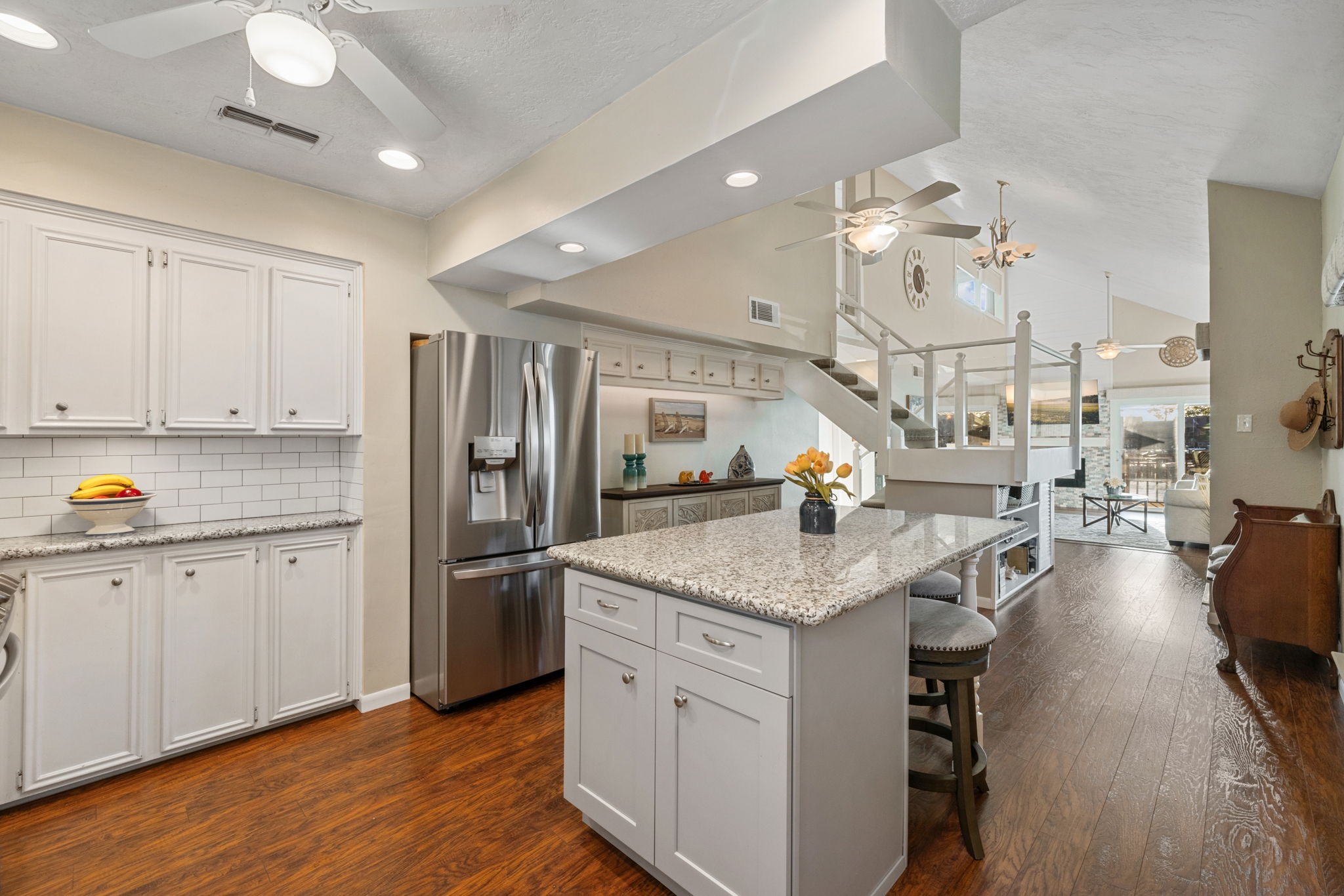 659 Davis Road League City, TX 77573 - Photo 11 of 34 a kitchen with stainless steel appliances granite countertop a sink dishwasher and a stove with wooden floor