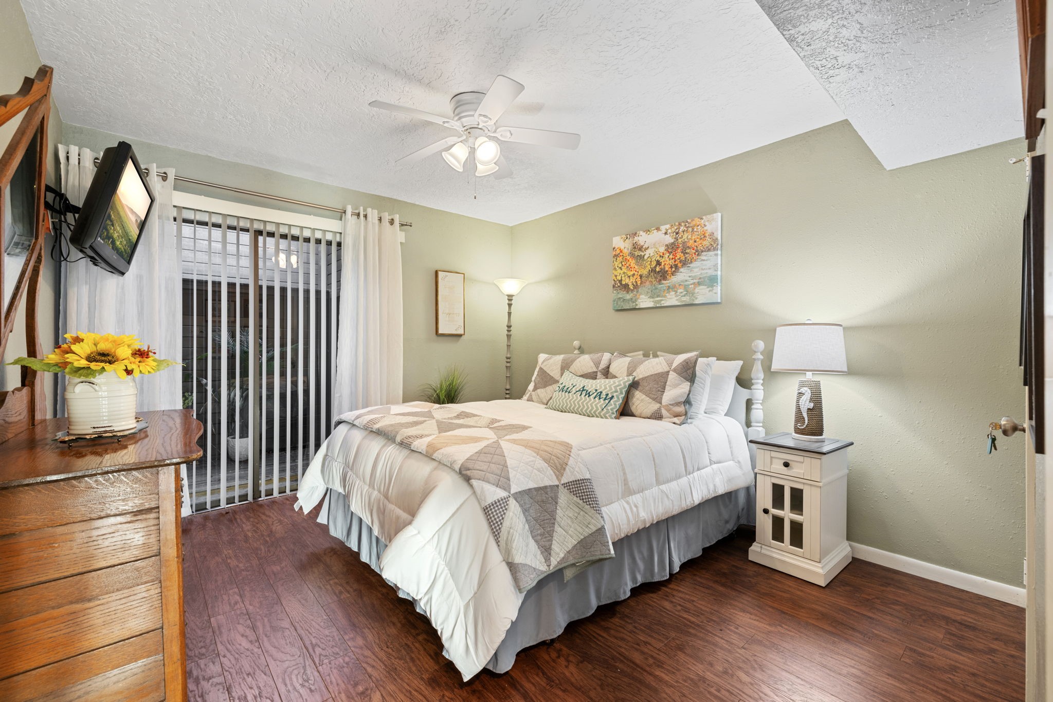 659 Davis Road League City, TX 77573 - Photo 12 of 34 a bedroom with a bed and wooden floor