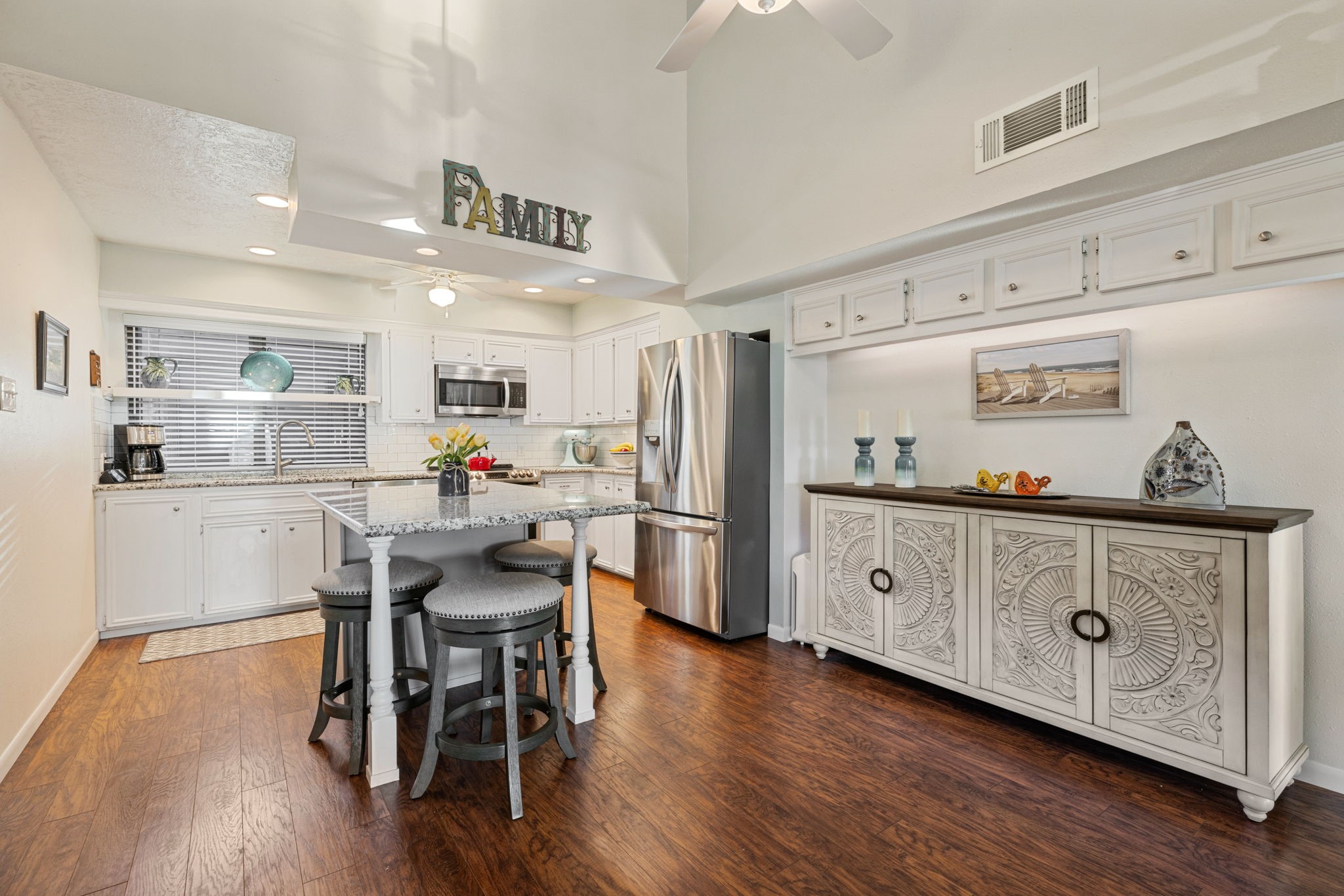 659 Davis Road League City, TX 77573 - Photo 9 of 34 a kitchen with stainless steel appliances granite countertop a table chairs stove and cabinets
