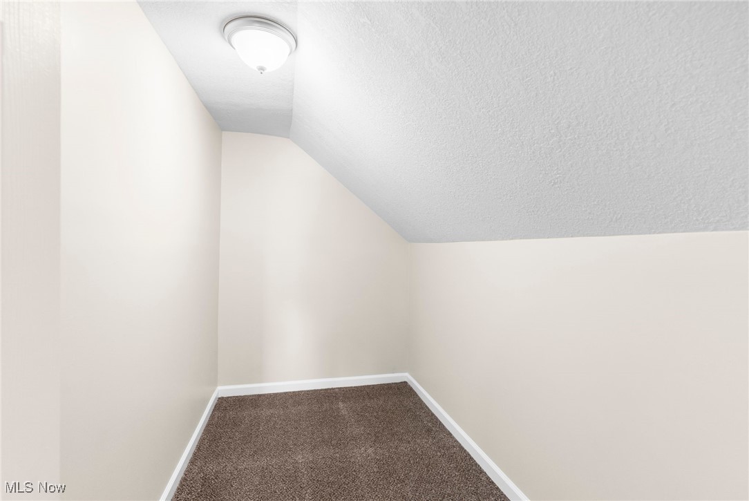 3441 Bell Wick Road Hubbard, OH 44425 - Photo 14 of 22 Bonus room with a textured ceiling, carpet, and vaulted ceiling