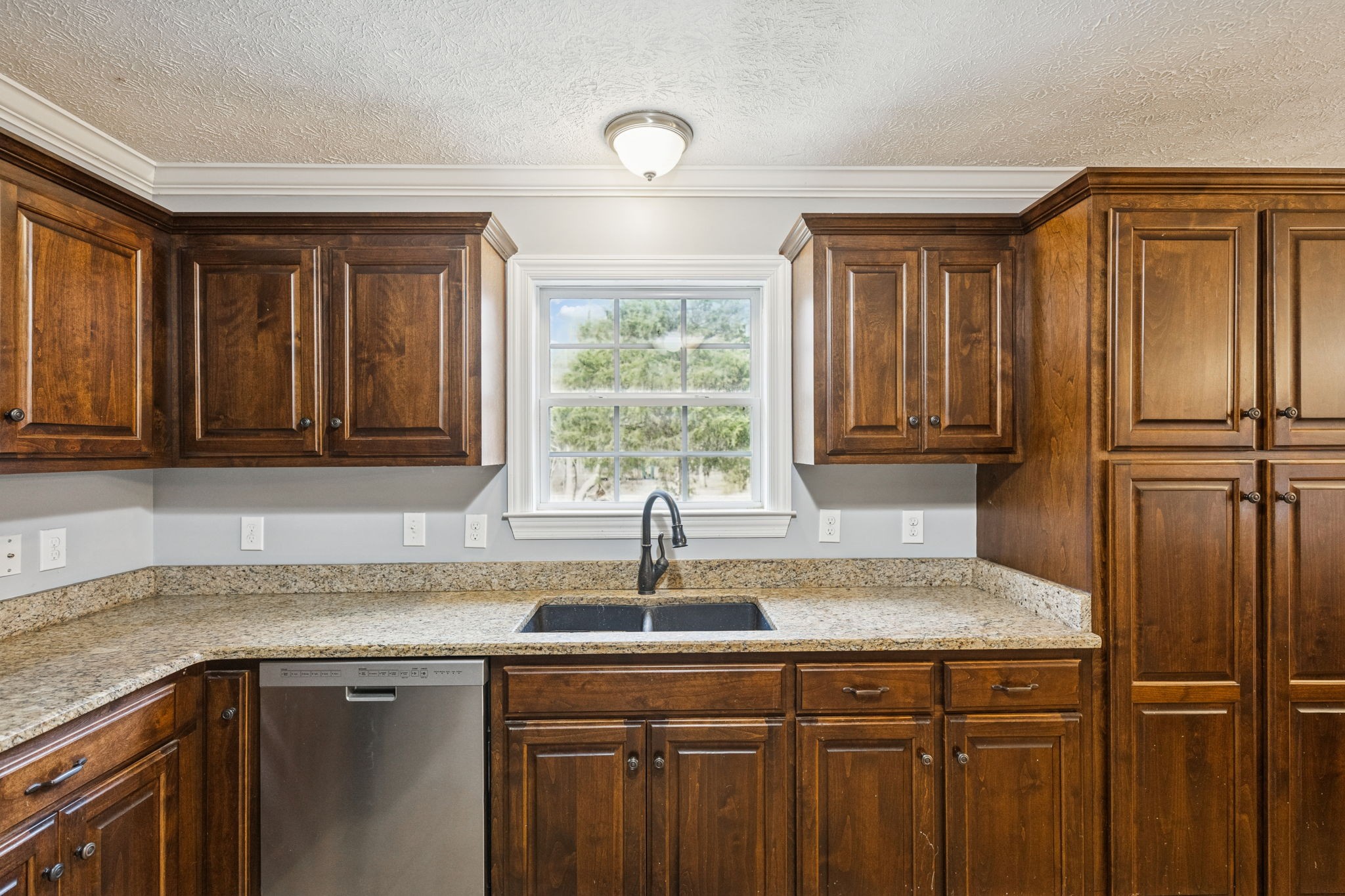 5453 Hillsboro Viola Road Manchester, TN 37355 - Photo 12 of 49 a kitchen with stainless steel appliances granite countertop a sink and a refrigerator