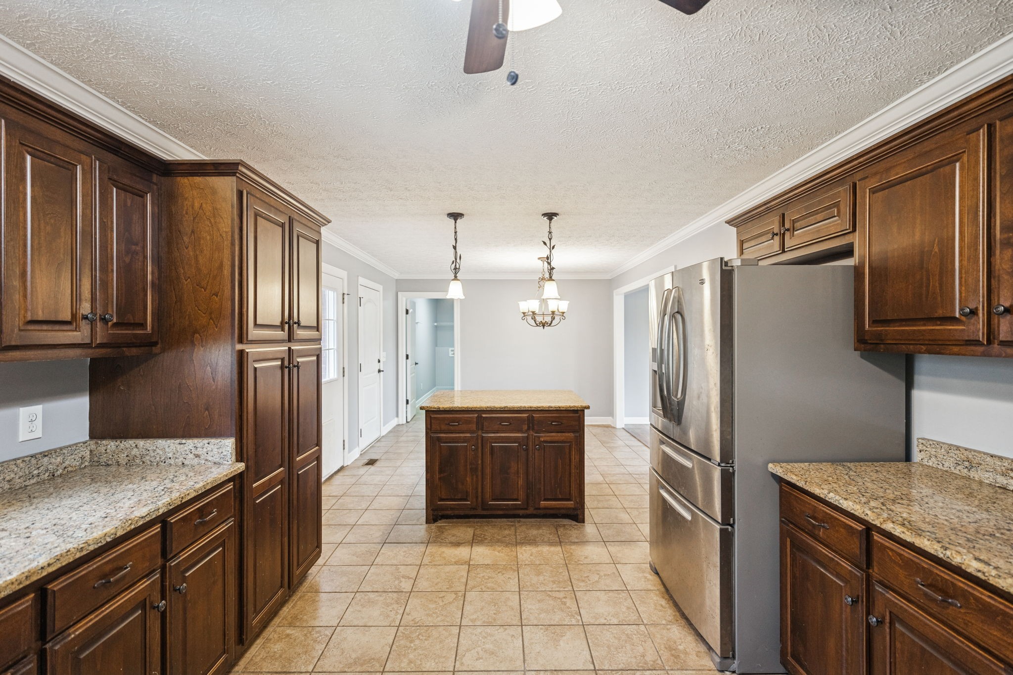 5453 Hillsboro Viola Road Manchester, TN 37355 - Photo 13 of 49 a kitchen with granite countertop a refrigerator and a sink