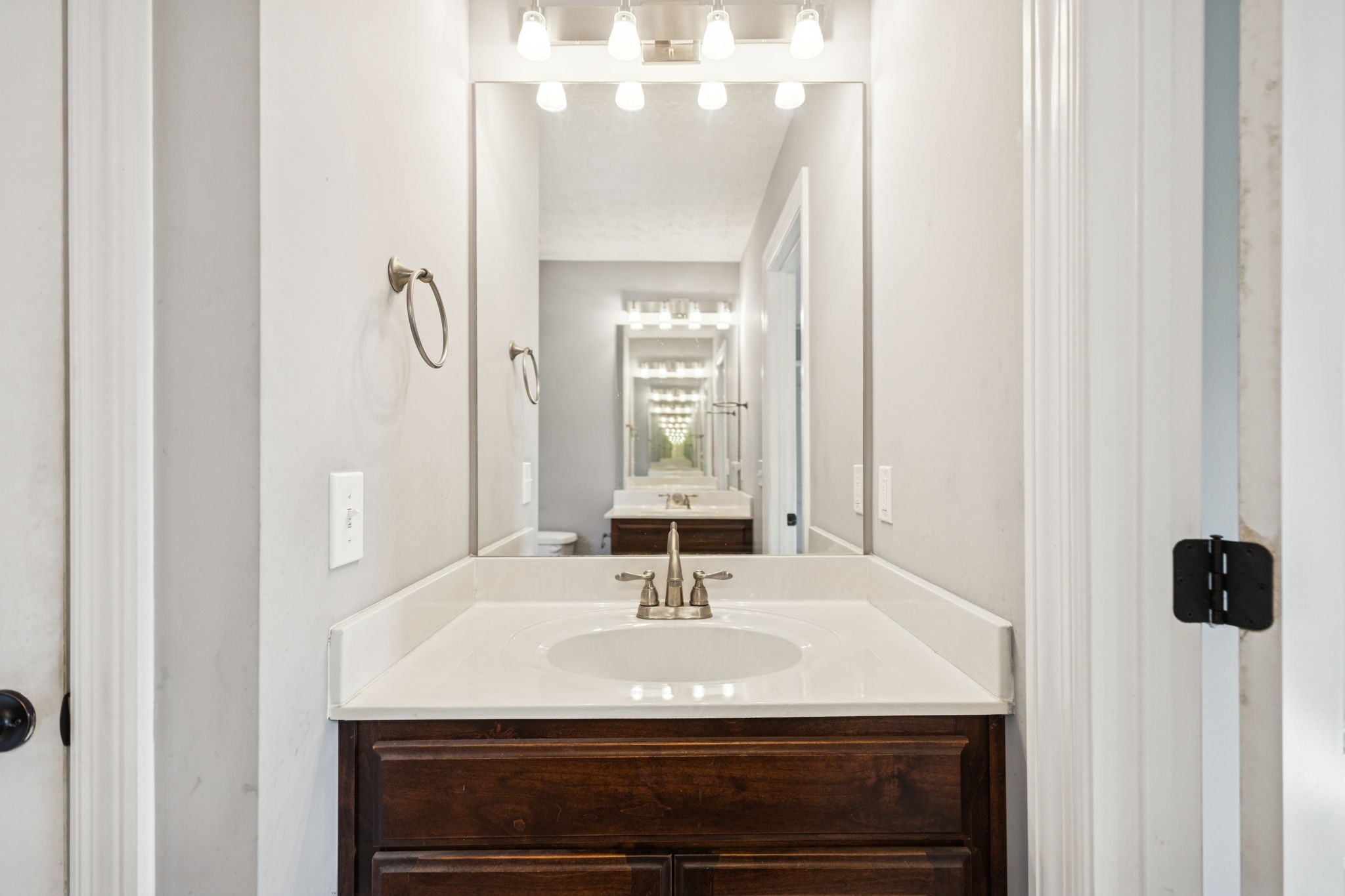 5453 Hillsboro Viola Road Manchester, TN 37355 - Photo 18 of 49 a bathroom with a sink and a mirror