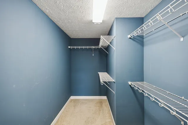 a view of a room with a fan and a fan