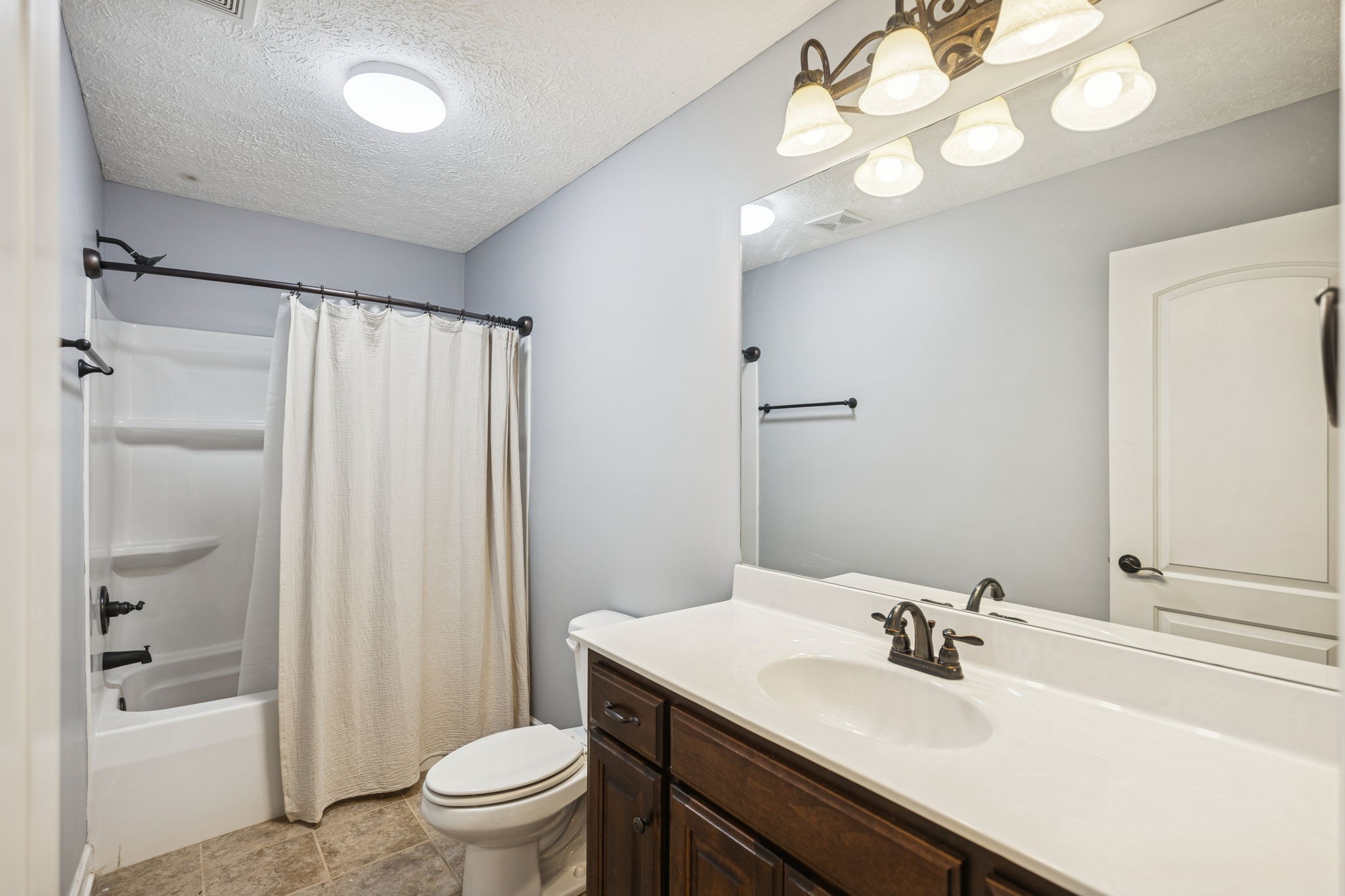 5453 Hillsboro Viola Road Manchester, TN 37355 - Photo 23 of 49 a bathroom with a sink a toilet and shower