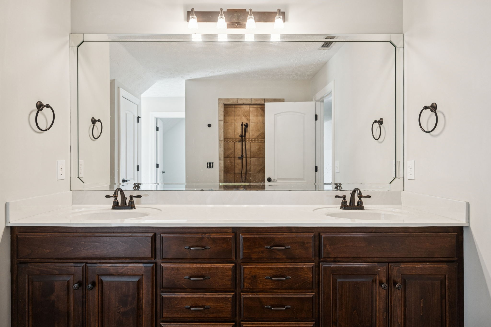 5453 Hillsboro Viola Road Manchester, TN 37355 - Photo 35 of 49 a bathroom with a double vanity sink and mirror