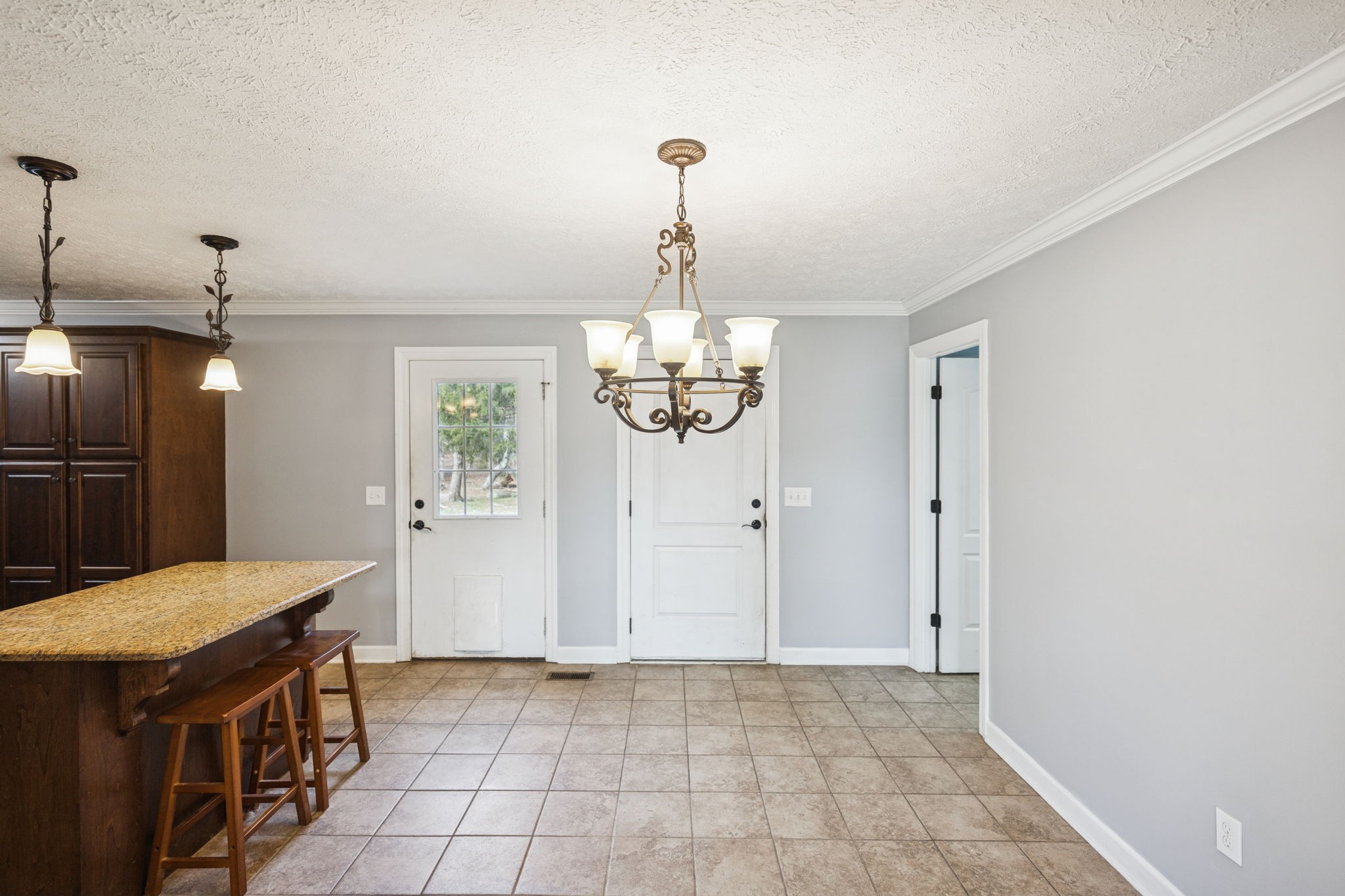 5453 Hillsboro Viola Road Manchester, TN 37355 - Photo 9 of 49 a kitchen with stainless steel appliances granite countertop a refrigerator a sink dishwasher a stove and a dining table with wooden floor