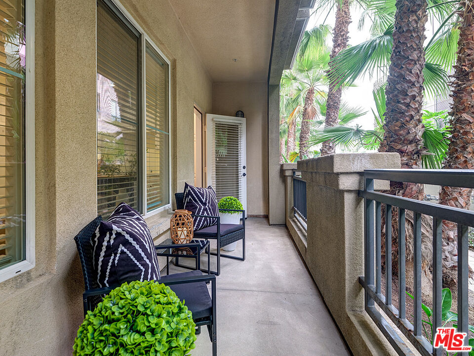 6020 South Seabluff Drive, Unit 122 Playa Vista, CA 90094 - Photo 11 of 33 a balcony with chairs and a table