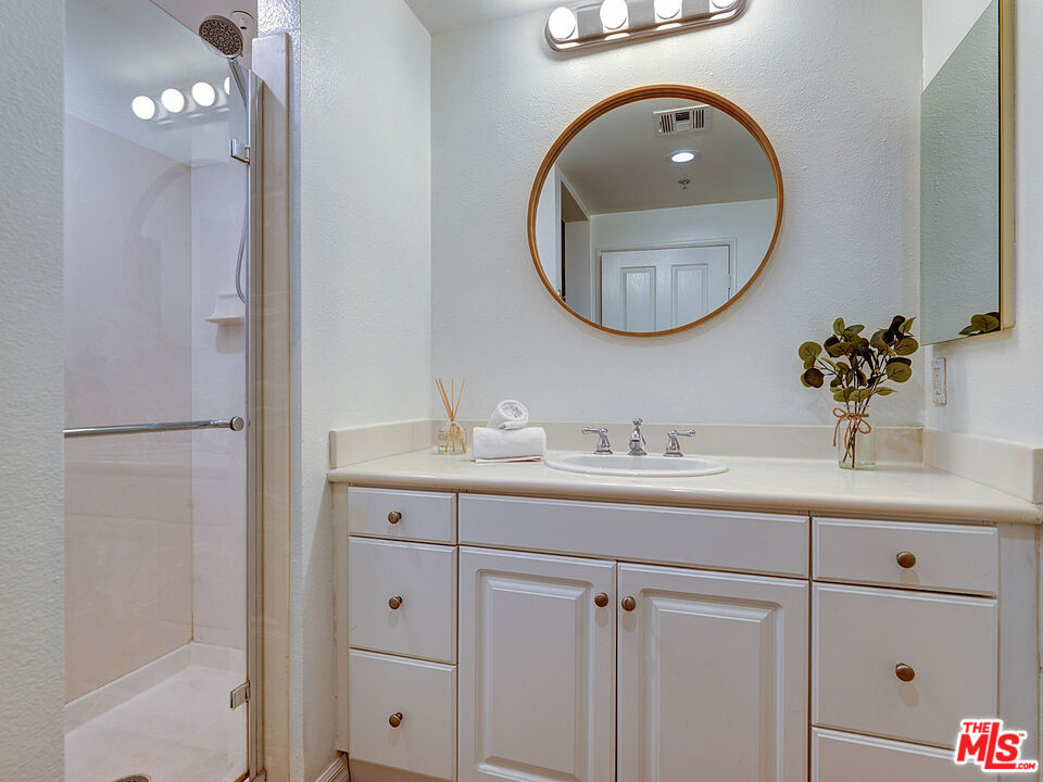 6020 South Seabluff Drive, Unit 122 Playa Vista, CA 90094 - Photo 15 of 33 a bathroom with a sink and a mirror