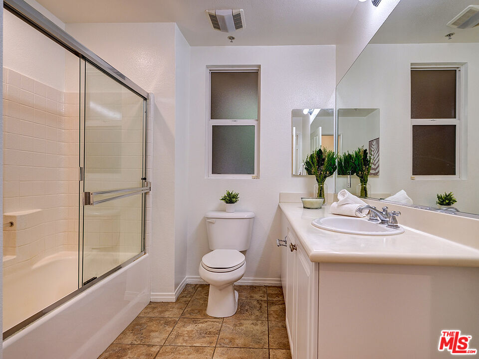 6020 South Seabluff Drive, Unit 122 Playa Vista, CA 90094 - Photo 20 of 33 a bathroom with a sink toilet and shower