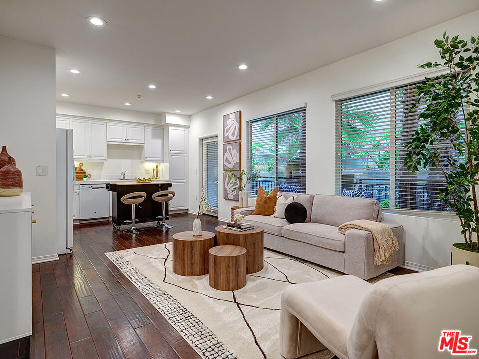 6020 South Seabluff Drive, Unit 122 Playa Vista, CA 90094 - Photo 4 of 33 a living room with furniture and a large window