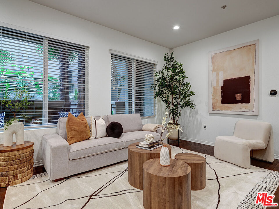 6020 South Seabluff Drive, Unit 122 Playa Vista, CA 90094 - Photo 6 of 33 a living room with furniture and a large window